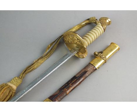 An American Officers' Naval sword and scabbard, circa 1945-52, with pierced guard, the Japanese blade three-quarter etched wi