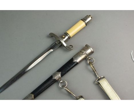 A Polish M1954 Air Force Officer's dagger with hanger, serial no. 19229 to the blade, yellow plastic grip, steel scabbard wit