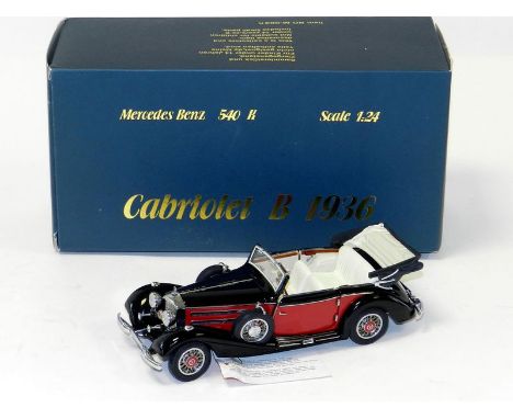 CMC Mercedes Benz 540K Cabriolet B 1936. 21.5cm, 1/24 scale. Two-tone black and red with off white interior. In original cond