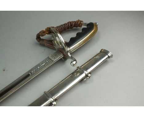 A US Army 1902 Officer’s sword, the blade by Theo. H. Davies & Co. Ltd, New York, with a a nickel-plated iron hilt and black 