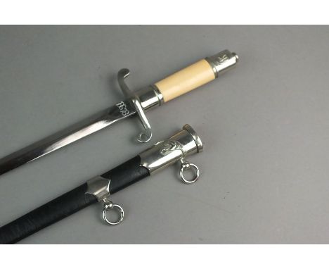A Polish M1954 Air Force Officer's dagger with scabbard, serial no. 18678 to the blade, yellow plastic grip, steel scabbard w