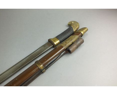 A Pre-World War Two Cossack or Soviet Russian Cavalry Officers Shashka sword and scabbard with fitted bayonet, hammer and sic