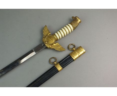 A Brazilian Air Force dagger and scabbard, mid-20th century, the hilt decorated with bird and coat of arms of the Federative 