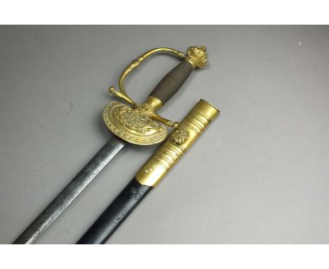 A Victorian court sword with brass clamshell guard, crown pommel and wirebound hilt, the guard with VR monogram within laurel