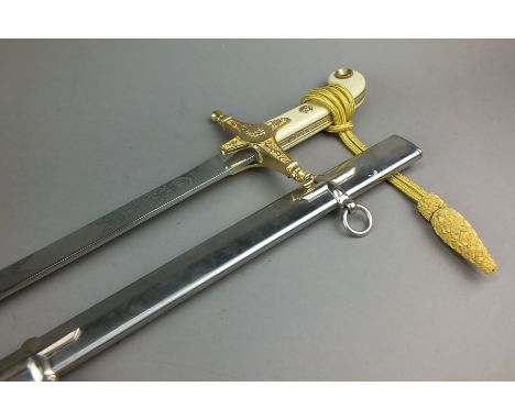 A modern Officer's mameluke style presentation sword, the etched and slightly curved blade by Wilkinson, the hilt with gilt c