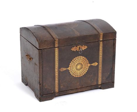 A Brown Leather and Gilt Tooled Cabinet, in the form of a dome top trunk, with hinged lid enclosing a fall front and divided 