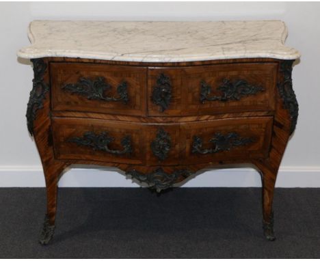 A Louis XV Kingwood and Rosewood Three Drawer Commode, late 18th century, with a grey and white Carrara marble top of serpent