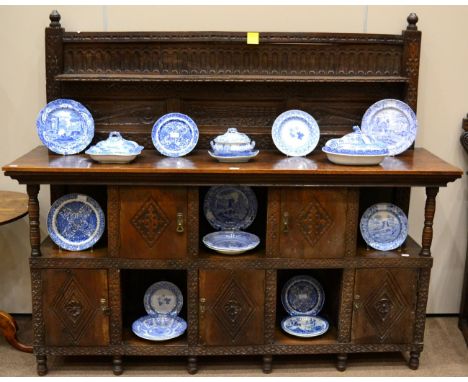 A Carved Oak Sideboard, carved with initials TA and dated 1693, the superstructure with a fluted panel above a shelf, three c