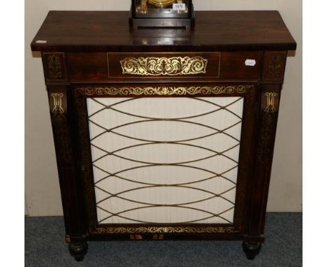 A Regency Rosewood and Brass Inlaid Side Cabinet, early 19th century, with brass grille door enclosing a shelf, raised on tur