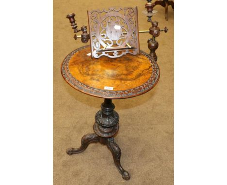 A Victorian Burr Walnut Circular Tripod Table/Music Stand, circa 1870, the carved top with adjustable candle arms and music r