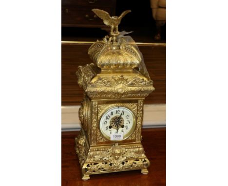 A Gilt Brass Striking Mantel Clock, early 20th century, architectural form case with shell and foliate scroll detail, pierced