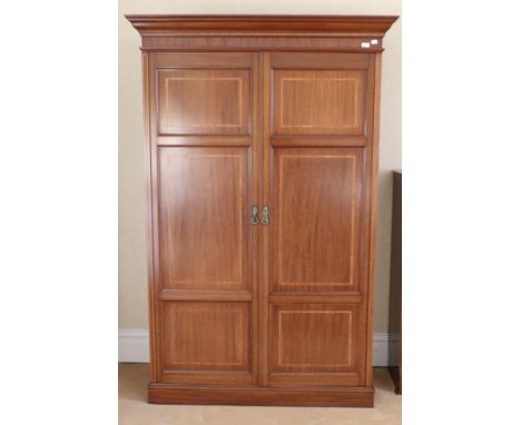 A Late Victorian Mahogany and Satinwood Banded Double Door Wardrobe, the doors with six recessed panels enclosing a shelf, ha