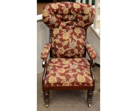 A Victorian Mahogany Framed Armchair, circa 1870, later recovered, with padded back support, arms and seat, raised on ring tu