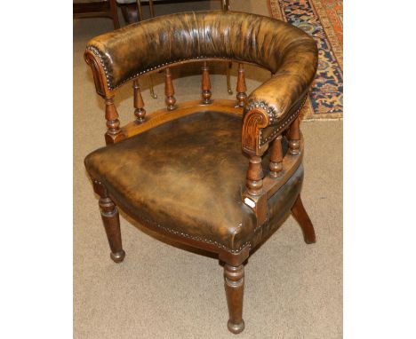 A Late Victorian Oak Tub Shaped Armchair, stamped CB, late 19th century, recovered in close-nailed brown leather with a turne