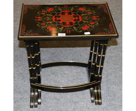 A Set of Three Japanned and Parcel Gilt Nesting Tables, 20th century, each decorated with painted flowers and foliage, raised
