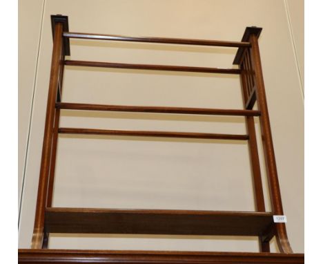 A Late Victorian Mahogany and Satinwood Banded Towel Rail, with slatted end supports and four chamfered rails, the base fitte