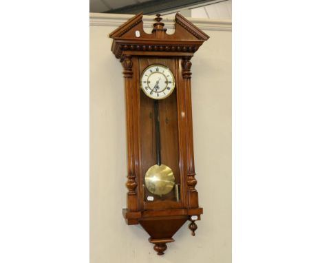 A Walnut Veneered Quarter Striking Wall Clock, circa 1900, fluted side columns, front and side glazed panels, enamel dial wit