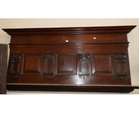 A Joined Oak Overmantel, the bold cornice above a plain frieze, with three fielded panels below divided by arched and fluted 