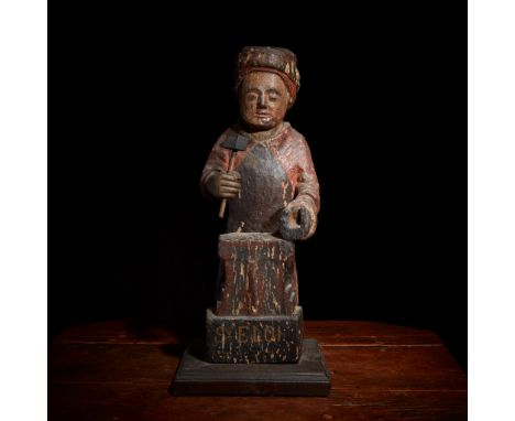 A French polychromed figure of Saint Eligius (Eloi) depicted as a farrierprobably 17th centuryThe hammer and base later repla