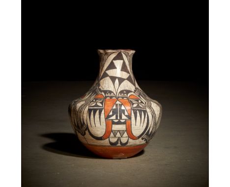 An Acoma polychrome jar Circa 1910 Decorated in a "bird head" design.H: 11 1/4 in.PROVENANCE:Eleanor Tulman Hancock, Inc., Ne