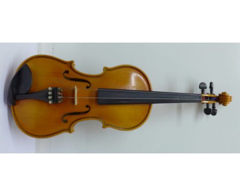 A Sonata violin, Rudall Carte & Co. Ltd., lacking bow and one string, cased, length of back 31cm excluding button
