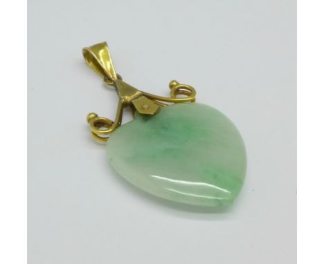 A 14ct gold and jade pendant