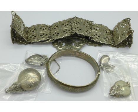 Four silver lockets and chains, a silver bangle and a metal belt, weight of silver 47g