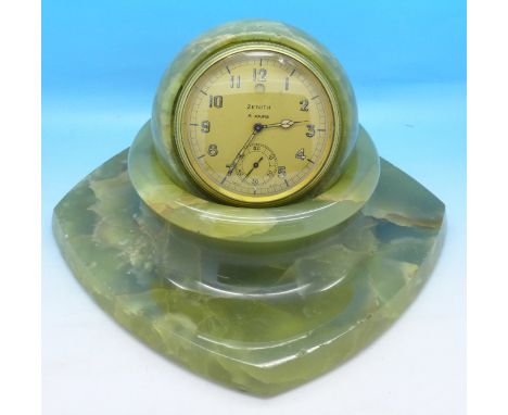 A Zenith 8-day clock set in an onyx ball, with onyx base, onyx a/f