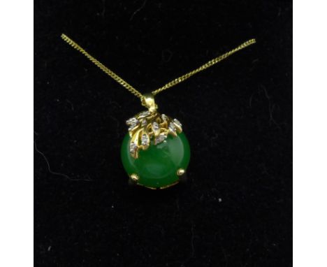 A rolled gold, jade and ten diamond pendant and chain