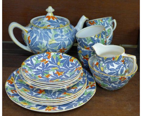 A four setting Barker Bros. Fantasy tea service, four cups, saucers, side plate, teapot, sugar and cream