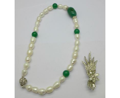 A cultured pearl and jade necklace and a floral paste set brooch