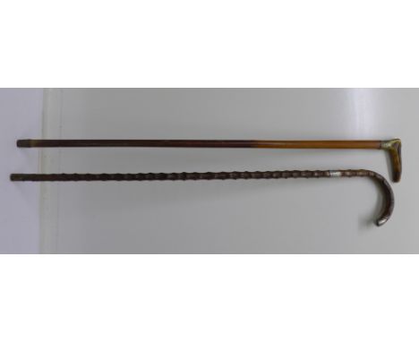 A hawthorn walking stick with silver embellishments and a horn handled walking stick (2)