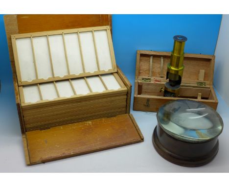 A microscope slide cabinet, viewer and a darkroom print magnifying glass