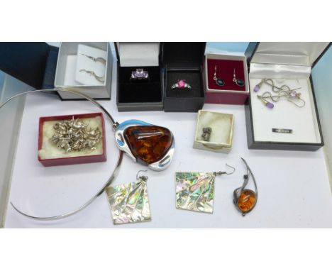 Assorted silver jewellery including amber, silver and amethyst ring and a silver charm bracelet, etc.