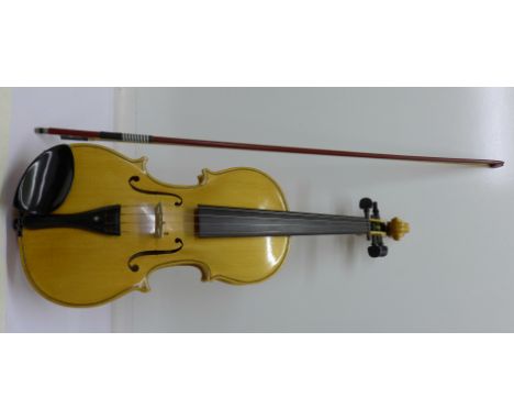 A cased violin and bow, length of back 36cm excluding button