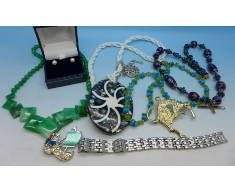 Costume jewellery including a titanium bracelet
