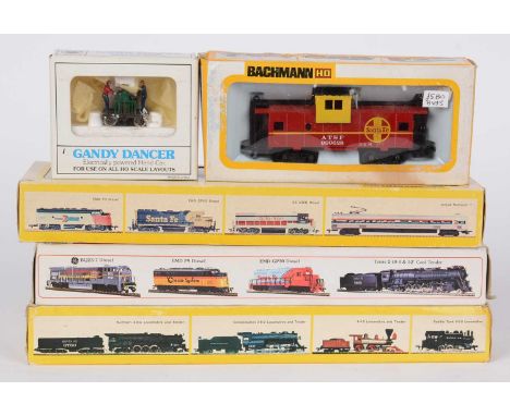 Bachmann HO gauge model railway, including: a steam locomotive and tender; two diesel electric locomotives; a dummy caboose; 