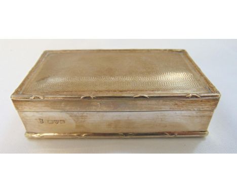 A hallmarked silver rectangular engine turned table snuff box with reed and tie borders, Chester 1908, approx total weight 16