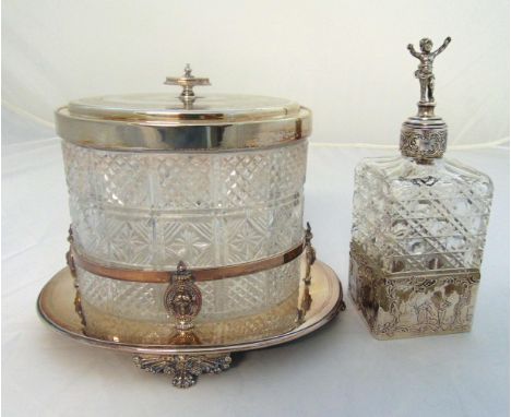 A late Victorian cut glass and silver plated biscuit barrel on raised oval base and a white metal and hobnail cut glass decan