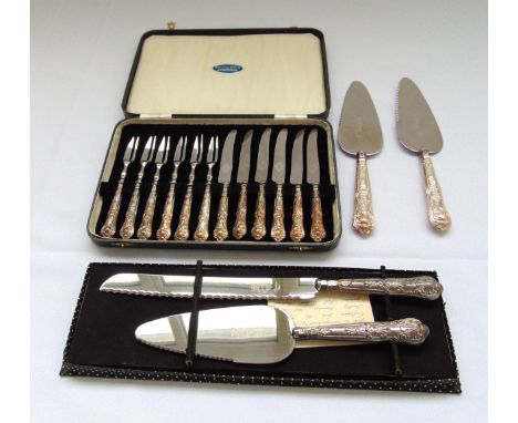 A quantity of hallmarked silver flatware to include cake slices, bread knives and cased dessert eaters