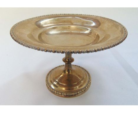 A hallmarked silver fruit stand with beaded borders on raised circular base, Sheffield 1910, approx total weight 278g