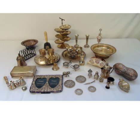 A quantity of silver plate to include a card tray, condiments, coasters, café au lait and a cigarette box