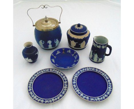 A quantity of 19th century blue jasperware to include a biscuit jar with silver plated cover and swing handle, a covered box,