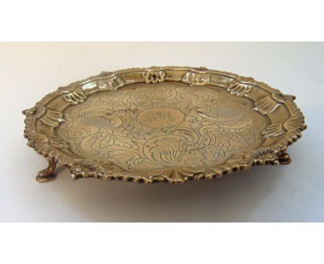 A George III hallmarked silver card tray gadroon and shell border, Victorian chasing to the centre on three stepped hoof feet
