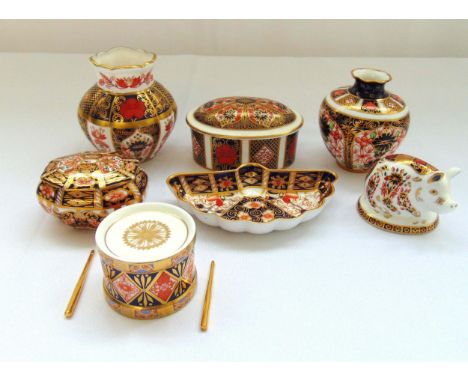 A quantity of Royal Crown Derby to include covered boxes, vases, a fan shaped dish, a model of a drum with gilded drumsticks 