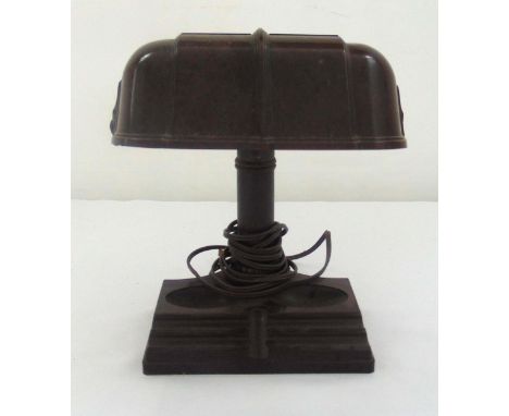 An American Bakelite desk lamp shaped oval with cylindrical stem on raised rectangular base 25 x 20 x 17cm