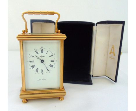 Angelus John Morley brass carriage clock of customary form, white enamel dial Roman numerals with chime in original packaging