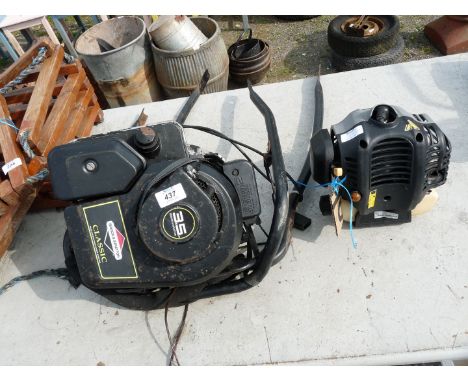 A "Titan" engine for spares and repair and "Briggs & Stratton" 3.5 HP 2 stroke engine.