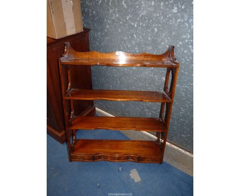 A Mahogany wall hanging shelf unit with three lower drawers.