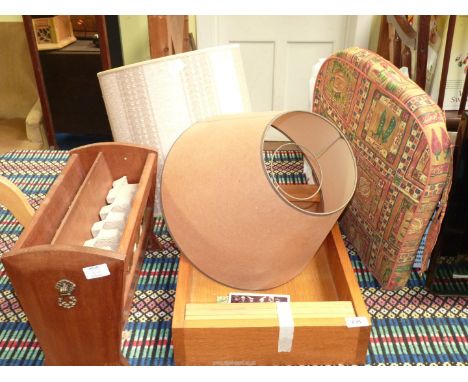 A small oak shelf unit, a cushion and two lamp shades, magazine rack, etc.